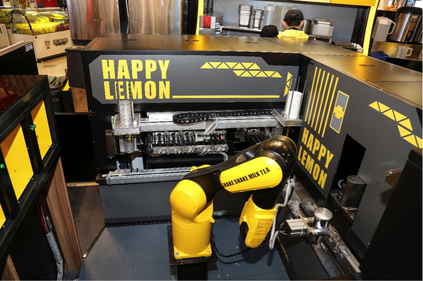 A robotic arm at work at Koubei and Happy Lemon's smart boba tea shop.