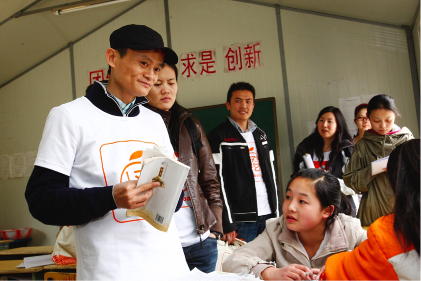 Jack Ma, executive chairman of Alibaba Group, joins volunteers in the quake-affected county, Qingchuan, in 2009.