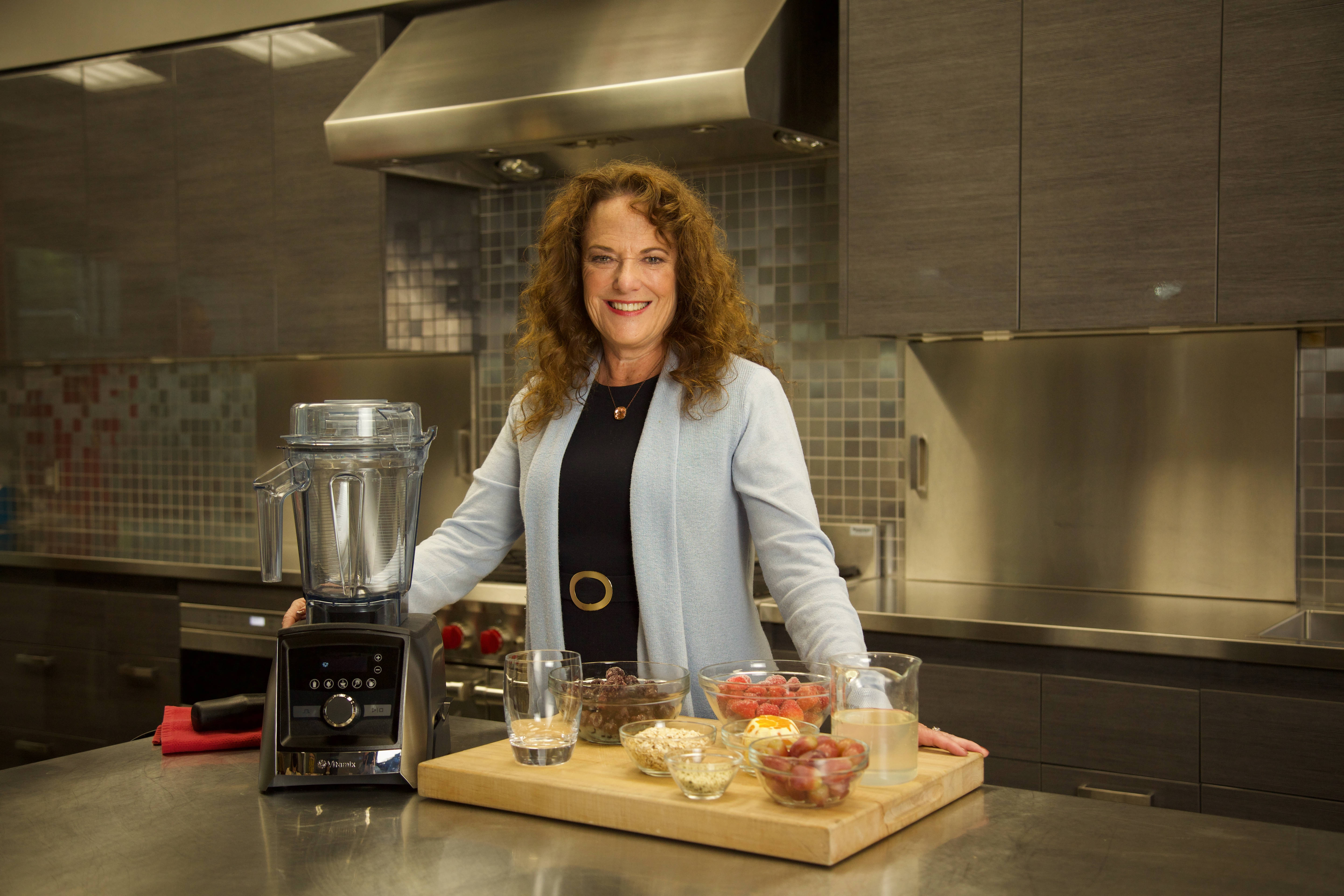 Vitamix CEO Jodi Berg stands with one of the company's blenders