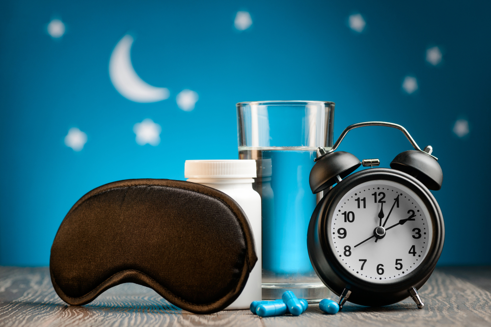 Mask,,Pills,And,Alarm,Clock,On,Night,Sky,Background.,How
