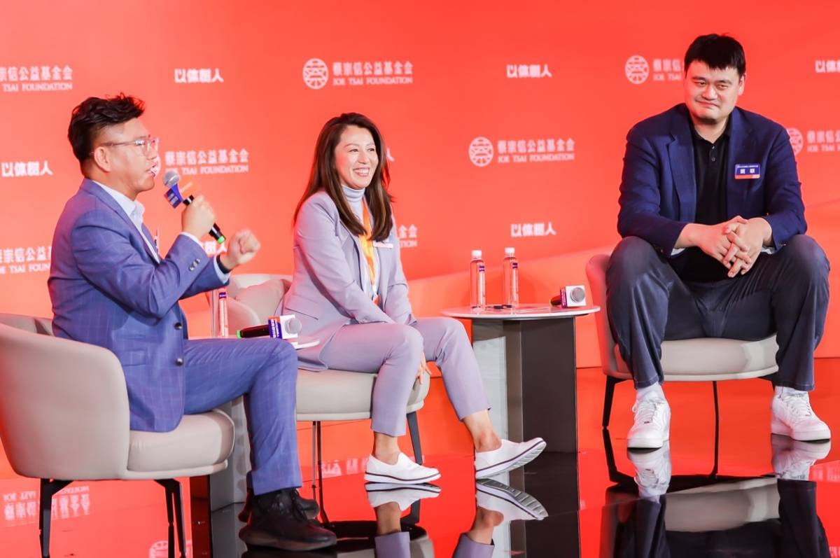 Yao Ming (right), Olympic gold medalist Yang Yang (centre) speak at the conference about the importance of sports education. Photo credit: Alibaba Group